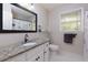 Bright bathroom with granite vanity, tile flooring, and ample natural light, perfect for a refreshing experience at 4270 Parnell Rd, Marietta, GA 30062