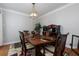 Stylish dining room with decorative lighting, dark wood furniture, and neutral paint at 4270 Parnell Rd, Marietta, GA 30062