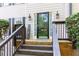 Eye-level shot of the front door with glass and sidelights flanked by matching wall lanterns at 4270 Parnell Rd, Marietta, GA 30062