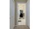 Hallway leading to home office with tiled floors, neutral paint, and recessed lighting at 4270 Parnell Rd, Marietta, GA 30062