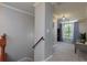 Bright hallway with neutral paint, crown molding, a carpeted floor, and a window with curtains at 4270 Parnell Rd, Marietta, GA 30062