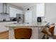 Well-lit kitchen featuring white cabinets, granite countertops, and modern appliances at 4270 Parnell Rd, Marietta, GA 30062