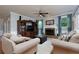 Comfortable living room with a brick fireplace, large TV, and comfortable seating at 4270 Parnell Rd, Marietta, GA 30062