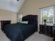Comfortable bedroom features dark furniture, neutral paint, and bright, natural light at 4270 Parnell Rd, Marietta, GA 30062