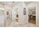 Bright bathroom featuring marble tile flooring, white trim, and doors leading to bedroom and walk-in closet at 559 Southland Cir, Canton, GA 30115