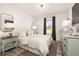 Cozy bedroom featuring natural light, neutral color scheme, and hardwood floors at 559 Southland Cir, Canton, GA 30115