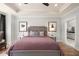 Serene bedroom with tray ceiling and ensuite bathroom access, designed for relaxation and privacy at 559 Southland Cir, Canton, GA 30115