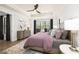 Tranquil bedroom featuring a ceiling fan and large windows for a bright and airy atmosphere at 559 Southland Cir, Canton, GA 30115