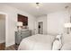 Comfortable bedroom showcasing neutral tones, a light gray dresser, and a serene atmosphere at 559 Southland Cir, Canton, GA 30115