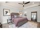 Comfortable bedroom with tray ceiling, featuring a soothing ambiance and access to an en-suite bathroom at 559 Southland Cir, Canton, GA 30115