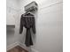 Well-organized closet featuring wire shelving and a gray robe, perfect for storage solutions at 559 Southland Cir, Canton, GA 30115