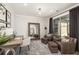 Stylish home office with leather chairs, large mirror, contemporary decor, and lots of light at 559 Southland Cir, Canton, GA 30115