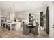 Open kitchen and breakfast nook featuring an island with seating and stainless-steel appliances at 559 Southland Cir, Canton, GA 30115