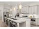 Modern kitchen featuring a large island with seating and stainless-steel appliances at 559 Southland Cir, Canton, GA 30115