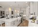 Open kitchen and living area featuring an expansive island and stainless-steel appliances at 559 Southland Cir, Canton, GA 30115