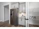 Well-equipped kitchen area with stainless steel refrigerator and convenient walk-in pantry with ample shelving at 559 Southland Cir, Canton, GA 30115
