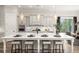 Bright kitchen featuring an island with barstool seating, modern appliances, and pendant lights at 559 Southland Cir, Canton, GA 30115