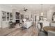 Spacious open-concept living area with a kitchen, dining area, and cozy seating by a fireplace at 559 Southland Cir, Canton, GA 30115