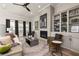 Spacious living room with fireplace, built-in shelves, and ample natural light creating a warm ambiance at 559 Southland Cir, Canton, GA 30115