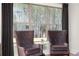 Cozy sitting area with comfortable chairs and view of trees, perfect for relaxation and enjoying the scenery at 559 Southland Cir, Canton, GA 30115