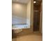 Bathroom features a soaking tub and a separate tiled shower at 611 Parkside Village Nw Way, Marietta, GA 30060