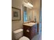 Bright bathroom featuring a vanity with storage, a mirror, and tile flooring at 611 Parkside Village Nw Way, Marietta, GA 30060