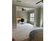 Spacious bedroom connects to a work space, light walls, and plush carpet enhance productivity at 611 Parkside Village Nw Way, Marietta, GA 30060