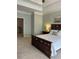 Bedroom featuring neutral carpet, a tray ceiling, and stairs leading to another level at 611 Parkside Village Nw Way, Marietta, GA 30060