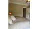 Comfortable bedroom with light walls, a plush bed, and a view of an open doorway at 611 Parkside Village Nw Way, Marietta, GA 30060