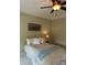Cozy bedroom features a ceiling fan, light walls, and plush bed for a relaxing atmosphere at 611 Parkside Village Nw Way, Marietta, GA 30060