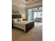 This bright bedroom features a sitting area, large window, and soft neutral carpet at 611 Parkside Village Nw Way, Marietta, GA 30060