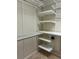 Walk-in closet with custom shelving and organization system at 611 Parkside Village Nw Way, Marietta, GA 30060