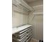 Walk-in closet with custom shelving and drawers at 611 Parkside Village Nw Way, Marietta, GA 30060