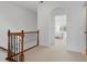 Second floor landing with wood railing and arched doorway at 611 Parkside Village Nw Way, Marietta, GA 30060