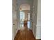 Hallway leading to living area, showcasing arched entryway and hardwood floors at 611 Parkside Village Nw Way, Marietta, GA 30060