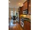 Bright kitchen features stainless appliances, granite countertops, and an eat-in breakfast nook at 611 Parkside Village Nw Way, Marietta, GA 30060