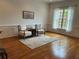 Living room featuring hardwood floors, bright windows, and neutral walls at 611 Parkside Village Nw Way, Marietta, GA 30060