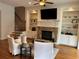 Inviting living room with a stone fireplace, built-in shelving, and cozy furniture at 611 Parkside Village Nw Way, Marietta, GA 30060