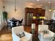 Inviting living room showcases hardwood floors and comfortable seating near a modern kitchen at 611 Parkside Village Nw Way, Marietta, GA 30060