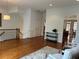 Open concept living room with hardwood floors, white walls and staircase at 611 Parkside Village Nw Way, Marietta, GA 30060