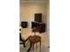 Comfortable living room featuring a large television on a wooden cabinet and neutral carpeting at 611 Parkside Village Nw Way, Marietta, GA 30060