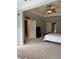 Expansive bedroom featuring tray ceiling, sitting area, and ensuite bathroom access at 611 Parkside Village Nw Way, Marietta, GA 30060