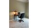Functional office space, featuring a desk, a chair, a laptop, and a lamp for efficient work at 611 Parkside Village Nw Way, Marietta, GA 30060