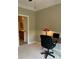 Functional office space features a desk, a chair, and a view to the bathroom at 611 Parkside Village Nw Way, Marietta, GA 30060