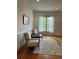 Cozy sitting area with natural light, hardwood flooring, and neutral-toned furniture at 611 Parkside Village Nw Way, Marietta, GA 30060