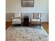 Inviting sitting area with hardwood flooring, accent rug, and decorative wall art at 611 Parkside Village Nw Way, Marietta, GA 30060