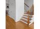 Bright staircase with wooden steps and iron balusters provides a stylish transition between floors at 611 Parkside Village Nw Way, Marietta, GA 30060