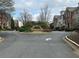 Street view of townhomes at The Gates at Parkside Village featuring beautiful landscaping and well-maintained exteriors at 611 Parkside Village Nw Way, Marietta, GA 30060