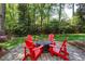 Backyard featuring fire pit with chairs on a stone paver patio at 131 Helmswood Sw Cir, Marietta, GA 30064