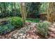 Secluded backyard featuring stone steps and lush greenery at 131 Helmswood Sw Cir, Marietta, GA 30064